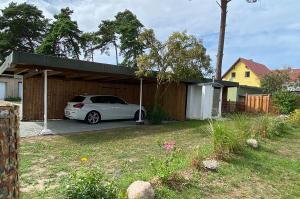 Carport und Räucherofen Ferienhaus Svante